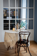 Cozy Cafe Table Setup with Candle and Flowers