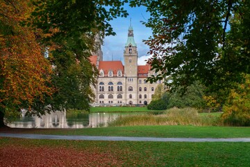 New City Hall of Hannover reflecting in water in the autumn, Hanover Maschpark, Lower Saxony, Germany. High resolution photo, desktop wallpaper