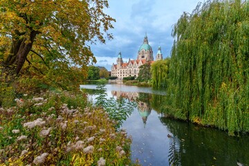 New City Hall of Hannover reflecting in water in the autumn, Hanover Maschpark, Lower Saxony, Germany. High resolution photo, desktop wallpaper
