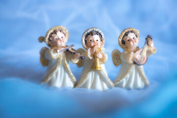 Guardian angel -  porcelain angels on a blue background	