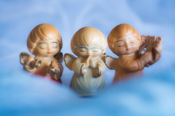 Guardian angel - wooden angels on a blue background	