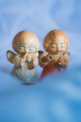 Guardian angel - wooden angels on a blue background	