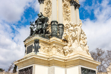 Fototapeta premium Sculptures at Monument to Alfonso XII in Buen Retiro park, Madrid, Spain
