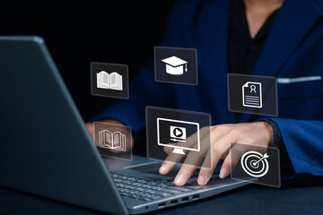 E-learning and digital education concept. Businessman using online learning platforms with icons of books, graduation cap, video course and certificate. Virtual learning and modern teaching tools.