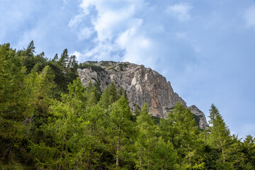 Explore the stunning landscape of Vrsic Pass in Bovec, Slovenia showcasing majestic mountains and a dramatic sky. Perfect for nature lovers.