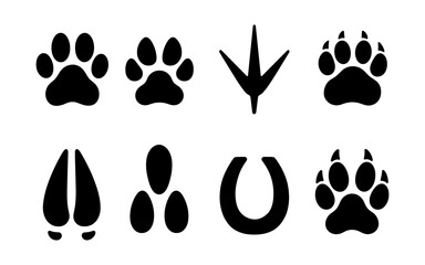 Silhouette set of animal tracks including dog paw, cat paw, bird footprint, bear track, deer hoof, horse shoe, and wild animal prints.