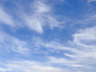 Swirling High Altitude Cirrus Clouds in Deep Blue Sky
