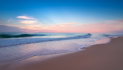 glistening ocean waves gently rolling onto a sandy beach under a soft pastel sky during twilight hours