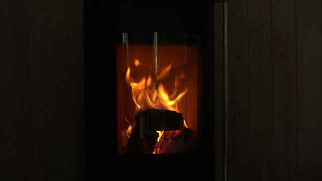 A fireplace with fire. A fire is burning in the fireplace. An atmosphere of coziness and warmth.