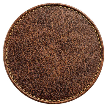 A round piece of textured brown leather with a finely stitched edge isolated on a plain , isolated on transparent background, perfect cutout, PNG