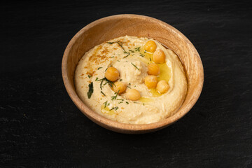 Hummus in bowl, houmous dip, chickpea humus tahini sauce, middle eastern spread