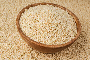 Sesame seeds pile closeup, white small benne grains. Sesamum indicum fruits