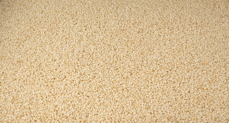 Sesame seeds pile textured background