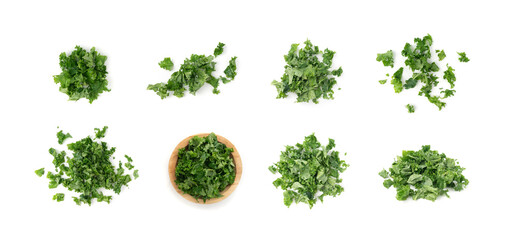 Obraz premium Pieces of kale cabbage leaves isolated. Green leaf of curly cabbage cooked for fresh salad