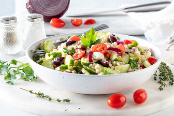 A bowl of fresh homemade Israeli couscous salad ready for eating.