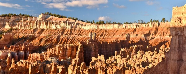 Stone hoodoos at sunrise in the amphitheater of Bryce Canyon National Park in Utah.