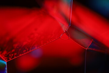 Red reflections of liquid in macro, red liquid surface, bubbles in macro, connection of bubbles in macro, cell from liquid, horror background, glossy surface panels