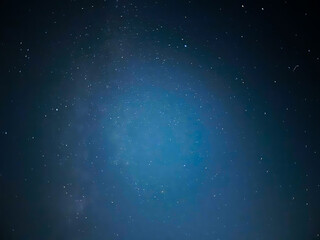Obraz premium Stunning Starry Night Sky over Dark Landscape