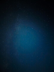 Fototapeta premium Stunning Starry Night Sky over Dark Landscape