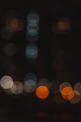 Abstract bokeh lights in the dark, creating a dreamy and artistic background. This image captures the beauty of blurred lights, perfect for adding a touch of elegance to any project. Night city lights