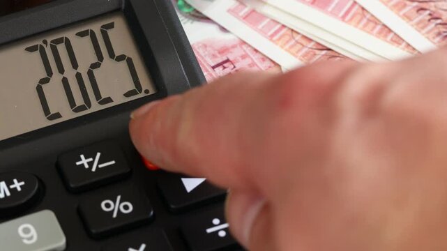 UK. Fiscal year 2026. Business and economics. Symbol for the British pound. Counting money. Year 2025 on a calculator, changing to 2026. Financial background. close up