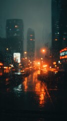 Obraz premium Rainy Night Cityscape Through A Wet Window