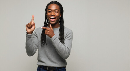 Young black woman smiling and gesturing sign language indoors  