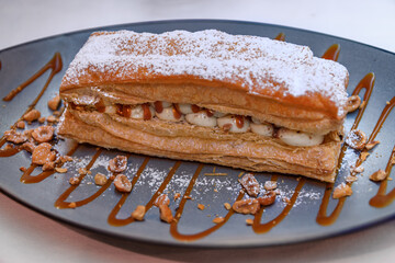 Millefeuille dessert with cream and caramel at a restaurant in Nice, France