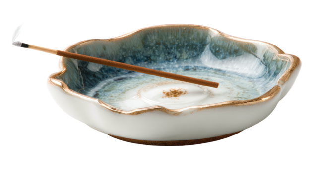 Decorative incense holder, shaped like a flower, holding a stick and ash, with a unique blue and white pattern