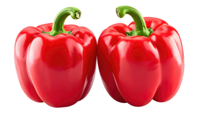 Two vibrant red bell peppers, side-by-side, with healthy green stems, isolated on a black background