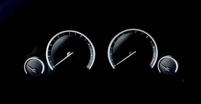 Minimalistic view of Sports car dashboard instruments on black background