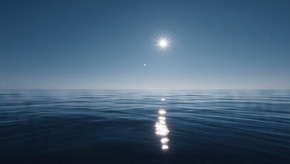 Obraz premium Bright sun reflects on calm ocean waters under a clear sky.
