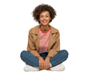 Smiling and happy young African-American teen girl, sitting on floor with legs crossed, isolated on white or transparent background