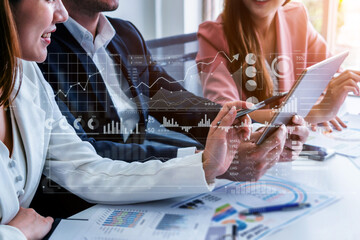 A group of professionals collaborates on financial strategies, utilizing modern technology and...