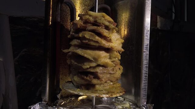 Enjoying homemade gyro preparation with flavorful ingredients and traditional methods in a cozy kitchen setting