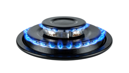 Black gas burner with blue flames on a black background. Flames evenly distributed around burner