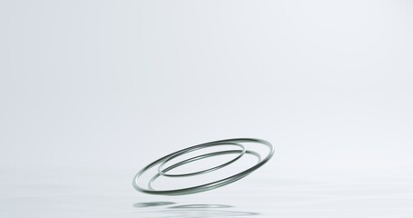 Minimalist 3D metallic rings floating on reflective white — clean, modern abstract design ideal for presentations, mockups, or luxury branding concepts.