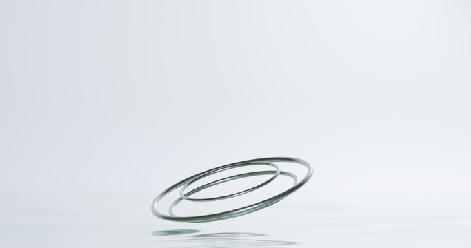 Minimalist 3D metallic rings floating on reflective white — clean, modern abstract design ideal for presentations, mockups, or luxury branding concepts.