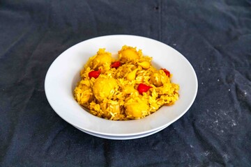 Traditional Brazilian dish of rice, chicken, and pequi (Brazilian caryocar), known as Goiana chicken stew.
