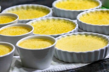Crème brûlée, creme brulée. Classic creme brulée being flambéed. Burning, flames, cabbage,...