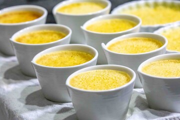 Crème brûlée, creme brulée. Classic creme brulée being flambéed. Burning, flames, cabbage,...