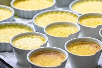 Crème brûlée, creme brulée. Classic creme brulée being flambéed. Burning, flames, cabbage, vanilla bean, blowtorch, sugar, blowtorch.