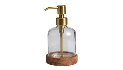 A clear glass soap dispenser with brass top and wooden base, set against a dark background