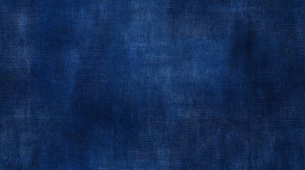Deep indigo textile texture displays subtle fading and woven pattern detail