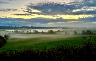 Aerial view of colorful autumn forest with morning mist of Prince Edward Island Canada. High...