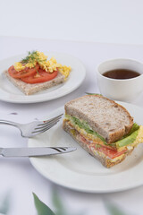 Delicious Breakfast and Lunch Spread with Sandwiches and Scrambled Eggs