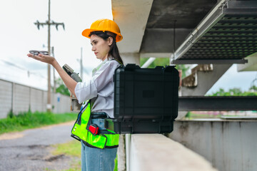 Female Engineer Using Drone for Infrastructure Survey