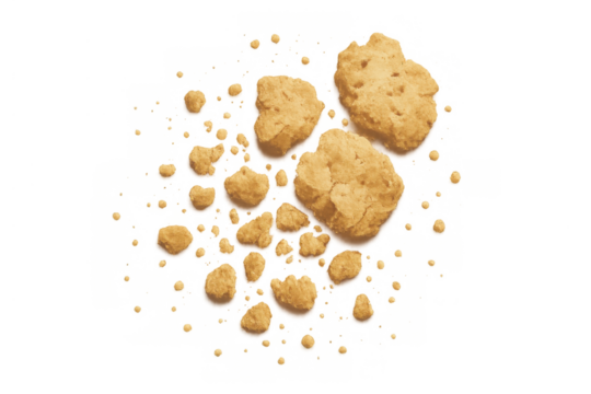 Broken cookie pieces and delicious crumbs scattered, sweet snack with transparent background