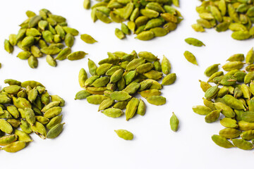 Green cardamom pods with aromatic and medicinal benefits.