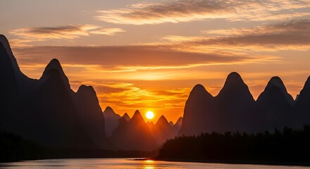 Spectacular sunrise over karst mountains and river in Guilin, China landscape